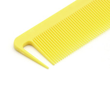 Comb with a metal tail, yellow color